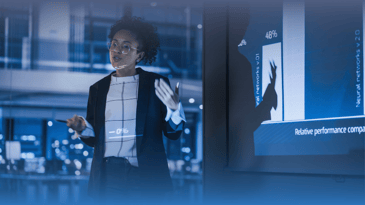 African American businesswoman gives presentation.