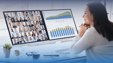 A woman in front of two monitors looking at data during a Zoom call